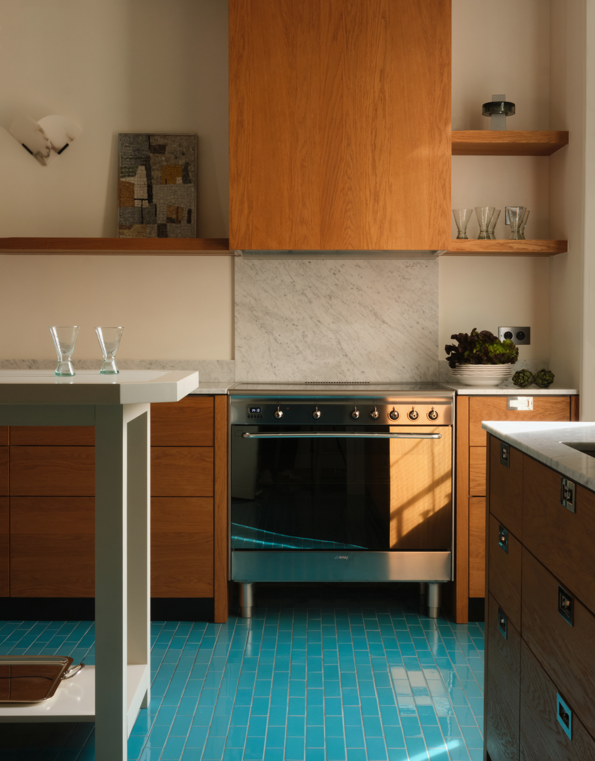 teal tiled floor kitchen with wooden cabinetry