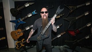 Guitarist Kerry King of Slayer displays the Dean Guitars Kerry King signature model guitar at the Dean Gordon Guitars Space at Anaheim Convention Center on April 13, 2023 in Anaheim, California