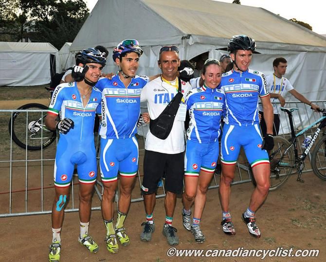 The Italians celebrate with the coach