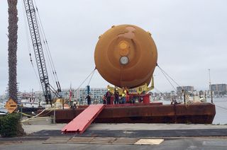 The space shuttle external tank ET-94 docks at Marina del Rey to be off-loaded and transported to the California Science Center, May 18, 2016.