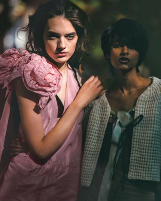 two women in semi formal cocktail dresses