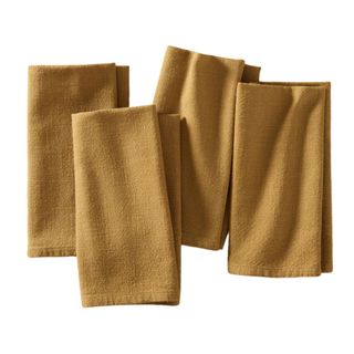Four gold dinner napkins