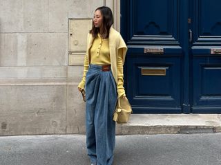 Aimee Song wearing a yellow sweater.