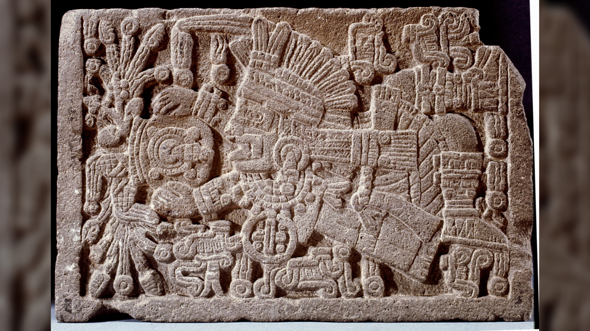 Base of a stone box which once contained the ashes of the Great Speaker, Ahuitzotl. The relief shows Tlaloc, the rain god, overturning a bowl of rain.