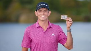 Jacob Bridgeman holding his PGA Tour card