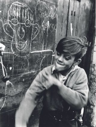 Boy playing conkers, 1957