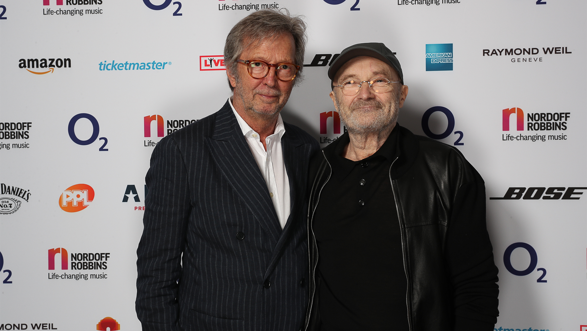 (L-R) Eric Clapton and Phil Collins during The Nordoff Robbins O2 Silver Clef Awards 2017. Grosvenor House, London. Friday, 30th June 2017.