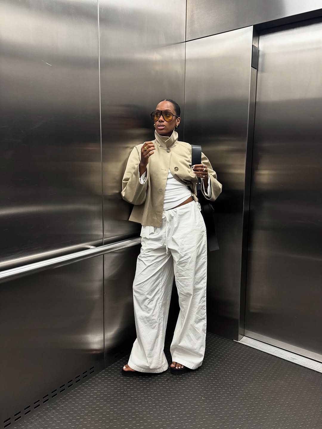 woman wearing winter to spring transitional jacket trends 2026