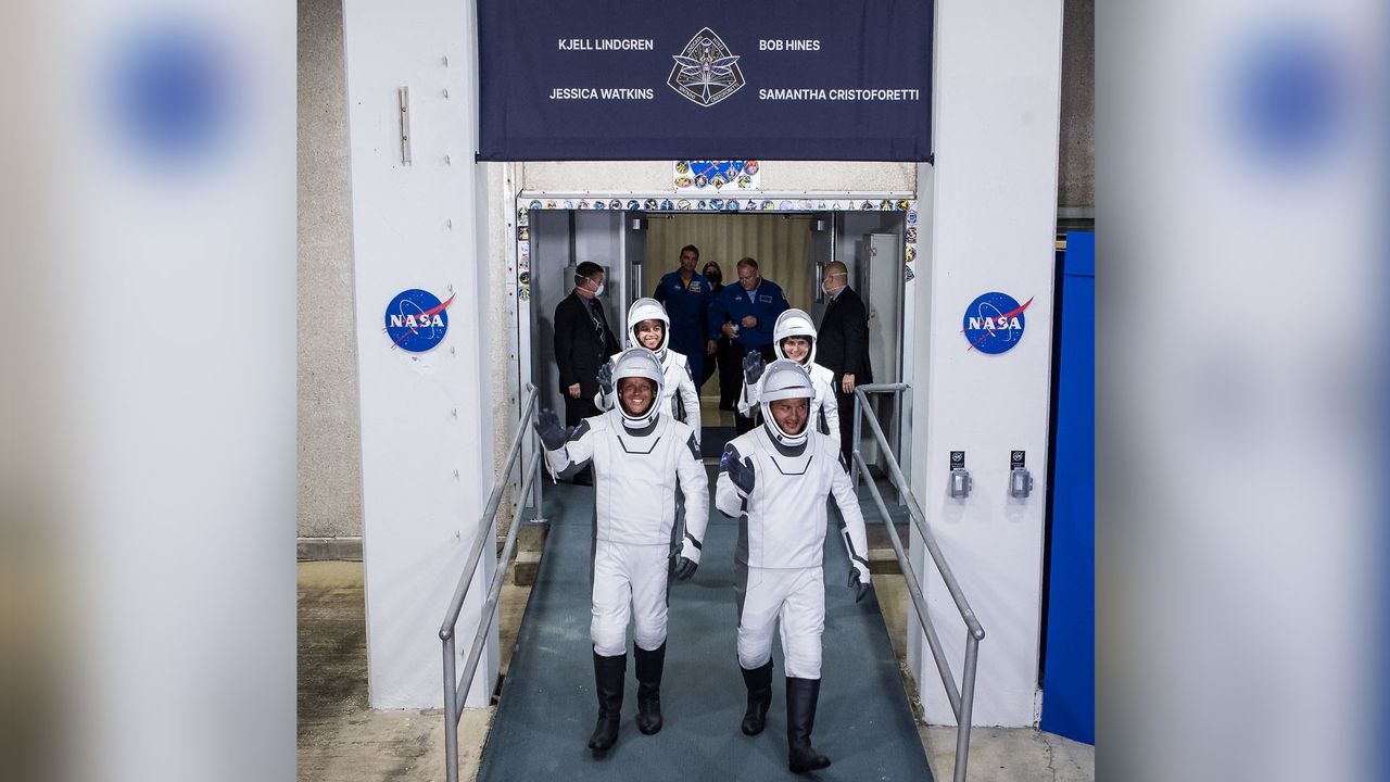 NASA astronauts Robert Hines, left, Kjell Lindgren, right, Jessica Watkins, back left, and ESA (European Space Agency) astronaut Samantha Cristoforetti, wearing SpaceX spacesuits, are seen as they prepare to depart the Neil A. Armstrong Operations and Checkout Building for Launch Complex 39A to board the SpaceX Crew Dragon spacecraft for the Crew-4 mission launch, Wednesday, April 27, 2022, at NASA&rsquo;s Kennedy Space Center in Florida.