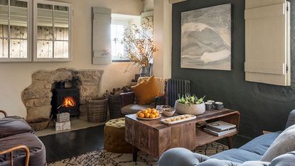 living room with sofa set arm chair and fireplace