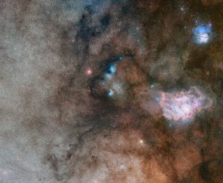 The stellar nursery Sharpless 29 resides at the center of this stunning view of a region in the constellation Sagittarius (The Archer) that is rich in stars. At right is the Lagoon nebula, while the Triffid nebula is visible at upper-right in this image from the European Southern Observatory's Digitized Sky Survey 2.