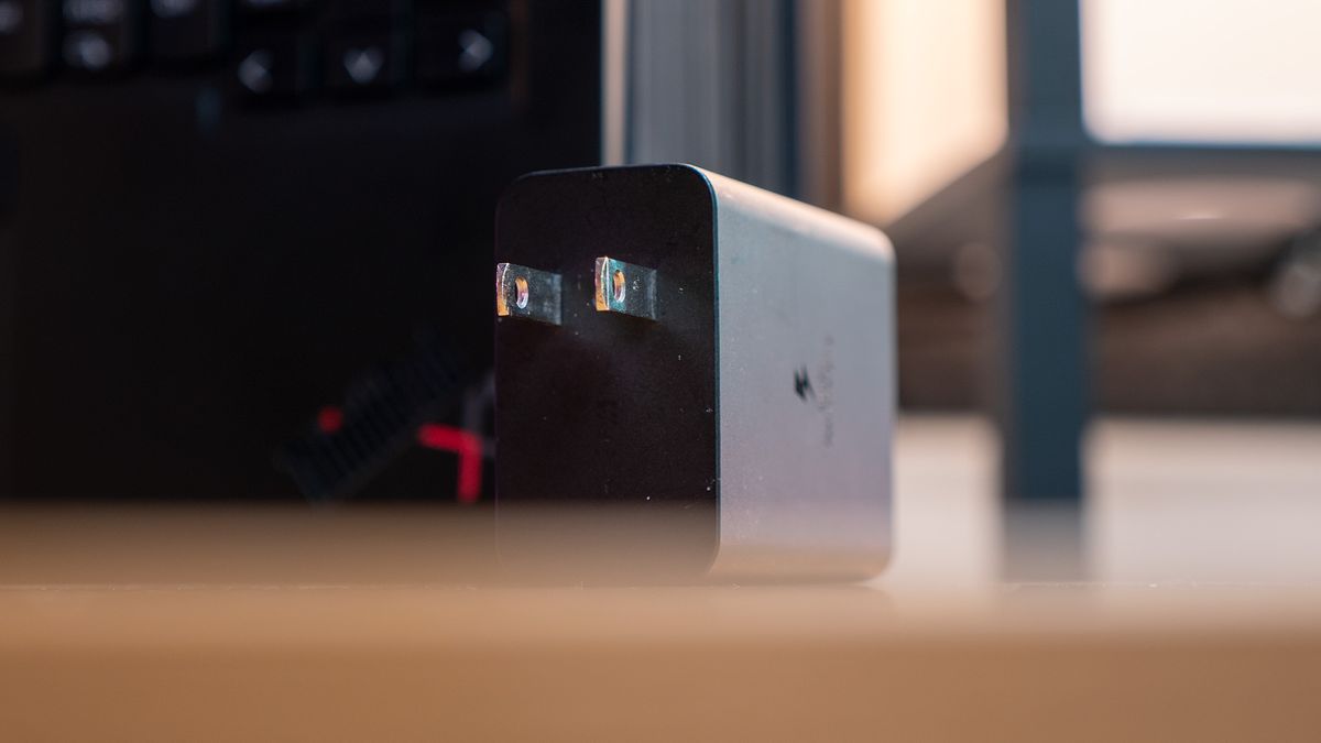 A picture of a phone charger on a desk