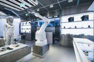 Robotic arm and mannequins inside ENG Shanghai luxury concept store