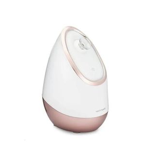 A white and rose gold facial steamer is one of the best beauty gifts for her.