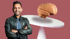 Dr Amir Khan next to brain balancing on platform, representing how to improve brain health