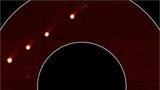A set of superimposed images captured by the Solar Orbiter show Comet Leonard and its two tails in visible light.