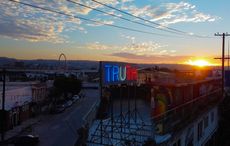 Stefan Brüggemann’s double-sided neon installation ’Truth / Lie’, installed on the roof of The Tunnel House in Tijuana, Mexico, overlooking the US/Mexico border