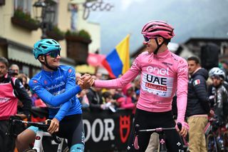 FIERA DI PRIMIERO ITALY MAY 23 LR Giulio Pellizzari of Italy and Team VF Group Bardiani CSF Faizane Blue Mountain Jersey and Tadej Pogacar of Slovenia and UAE Team Emirates Pink Leader Jersey prior to the 107th Giro dItalia 2024 Stage 18 a 178km stage from Fiera di primiero to Padova UCIWT on May 23 2024 in Fiera di primiero Italy Photo by Tim de WaeleGetty Images