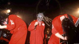 Slipknot performing onstage in 2000