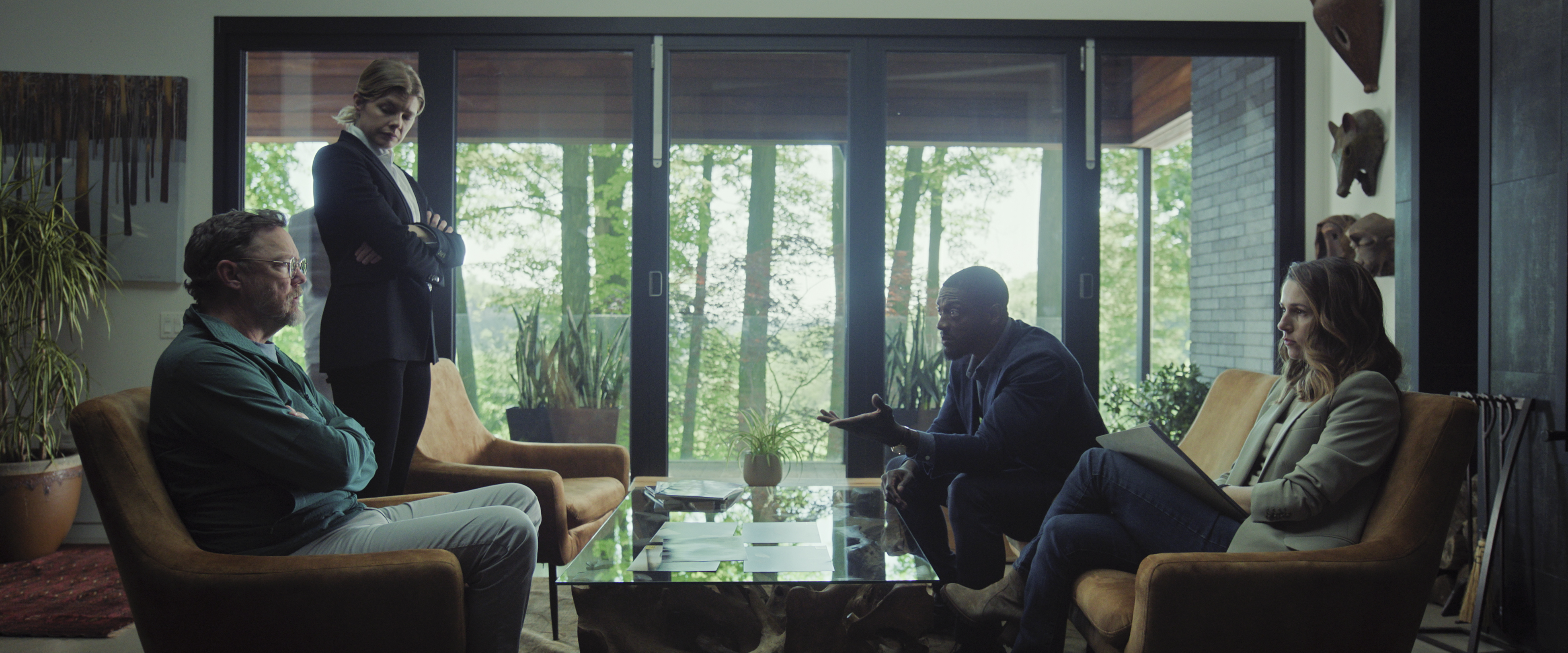 Matthew Lillard as Lance Durand, Lou Jurgens as Nat Gancarz, Alona Tal as Kayla Craig, Aldis Hodge as Alex Cross sitting in a living room surrounding by large windows with trees in a still from cross season 2