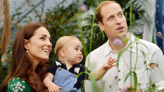 Catherine, Duchess of Cambridge holds Prince George as he and Prince William, Duke of Cambridge's look on while visiting the Sensational Butterflies exhibition at the Natural History Museum on July 2, 2014 in London, England