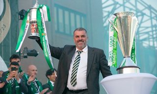 Ange Postecoglou, pictured after winning a domestic treble at Celtic in June 2023, is working as an ITV pundit at Euro 2024.