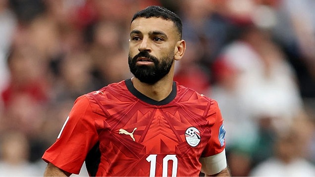 Mo Salah, wearing red, looks on during a game at the World Cup 2026.