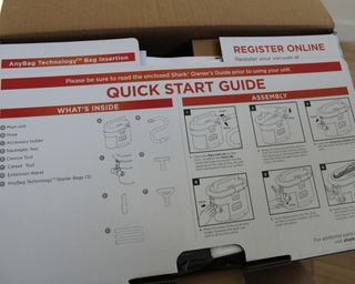 Shark MessMaster packaging with quick start guide detailing parts with pictograms and instructions on how to set up the carpet cleaner