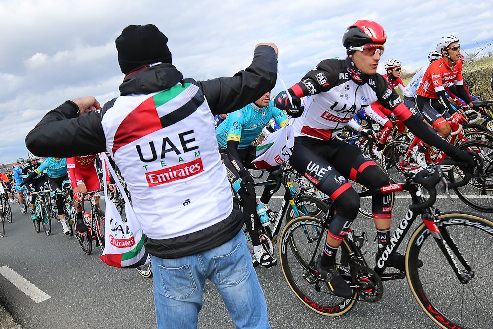 Sven Erik Bystrom (UAE Team Emirates) takes on food at Paris-Nice