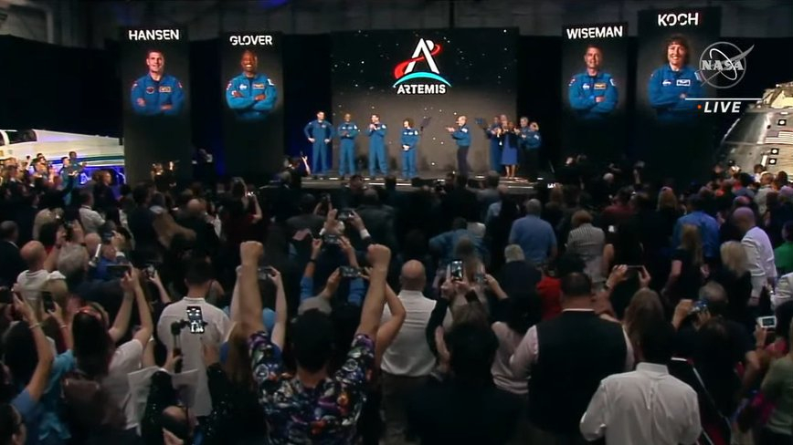 NASA's Artemis 2 moon crew are unveiled to the world, standing on a stage at Ellington Field near Johnson Space Center in Houston on April 3, 2023.