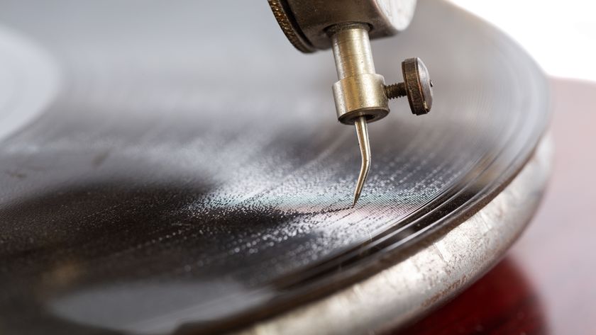 A closeup shot of a needle of the gramophone with a shellac disk.