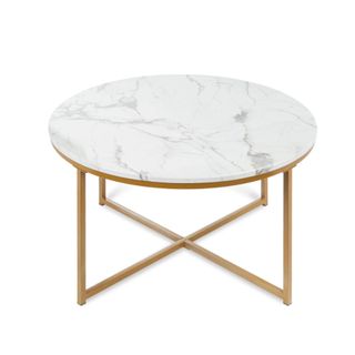 A circular marble table with gold crossed legs