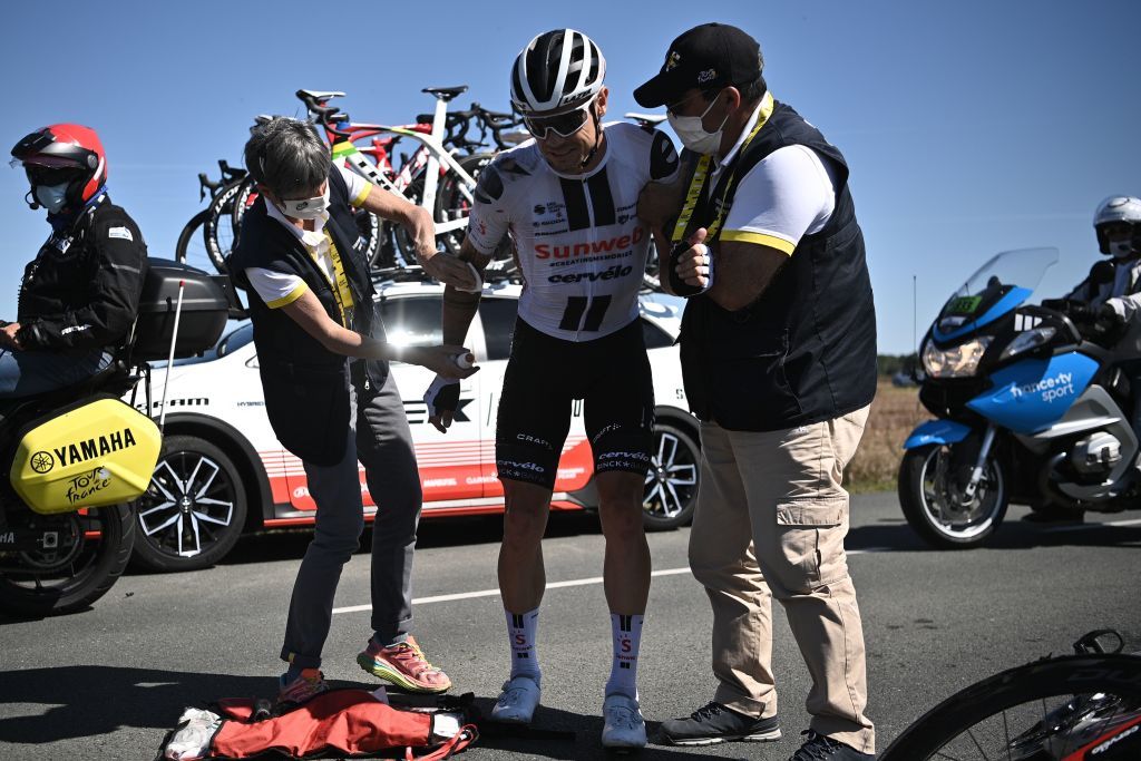 Team Sunweb rider Irelands Nicolas Roche is helped by medics after crashing during the 10th stage of the 107th edition of the Tour de France cycling race 170 km between Le Chateau dOleron and Saint Martin de Re on September 8 2020 Photo by AnneChristine POUJOULAT AFP Photo by ANNECHRISTINE POUJOULATAFP via Getty Images