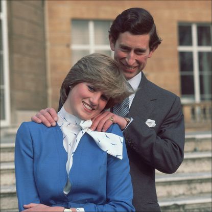 Princess Diana wears royal blue and King Charles puts his hands on her shoulders, while her brother, Charles Spencer, looks on