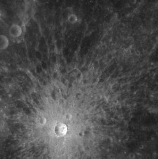 NASA's Messenger spacecraft spots an apparently fresh crater on Mercury during its early orbits on March 29, 2011. The crater (near image bottom) is about 4 miles (6.4 km) wide and is a beautiful example of a relatively small, simple, fresh impact feature