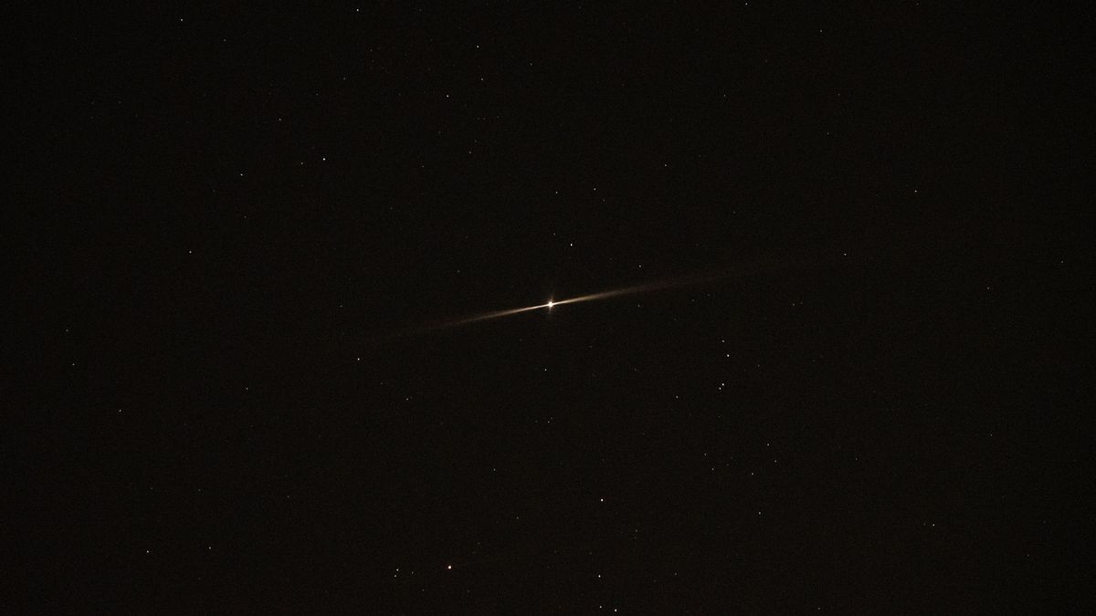 Jupiter shining with two beams in the night sky