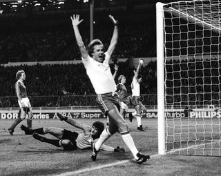Liverpool full-back Phil Neal celebrated a Switzerland own goal at Wembley during their Group 4 qualifier for the 1982 World Cup. (PA Archive)
