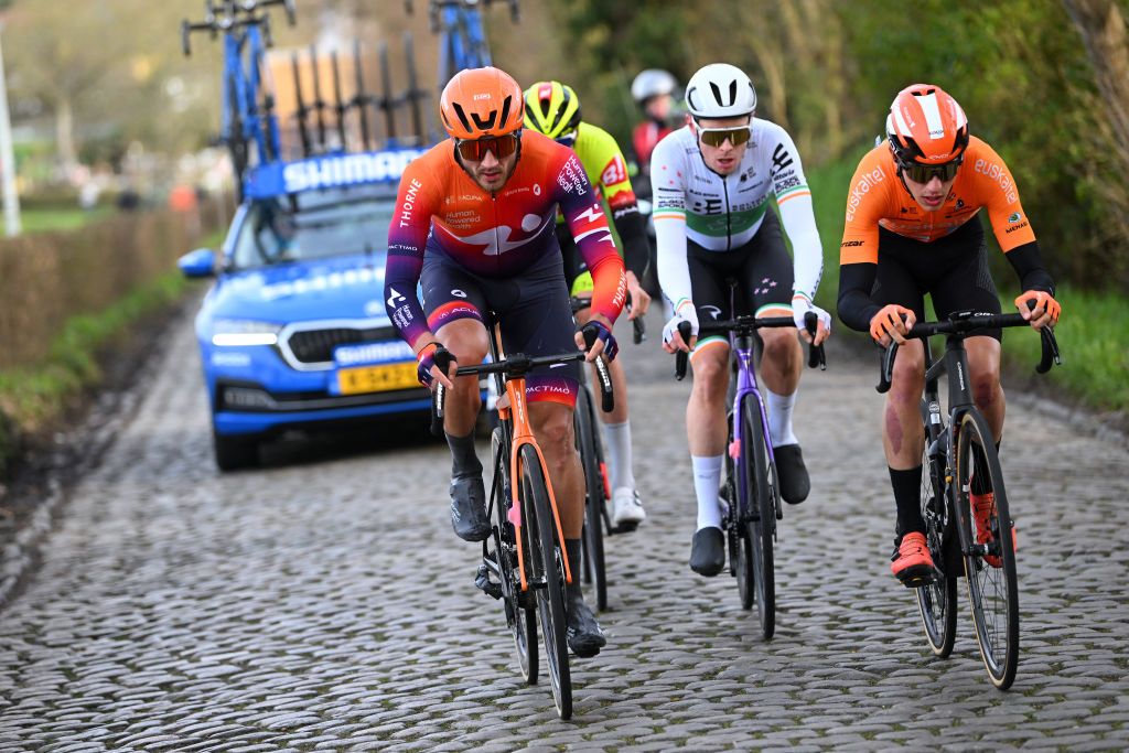NOKERE BELGIUM MARCH 15 LR Adam De Vos of Canada and Team Human Powered Health Rory Townsend of Ireland and Team Bolton Equities Black Spoke and Enekoitz Azparren of Spain and Team Euskaltel Euskadi compete in the breakaway during the 77th Danilith Nokere Koerse 2023 Mens Elite a 1936km one day race from Deinze to Nokere DanilithNokereKoerse on March 15 2023 in Deinze Belgium Photo by Luc ClaessenGetty Images