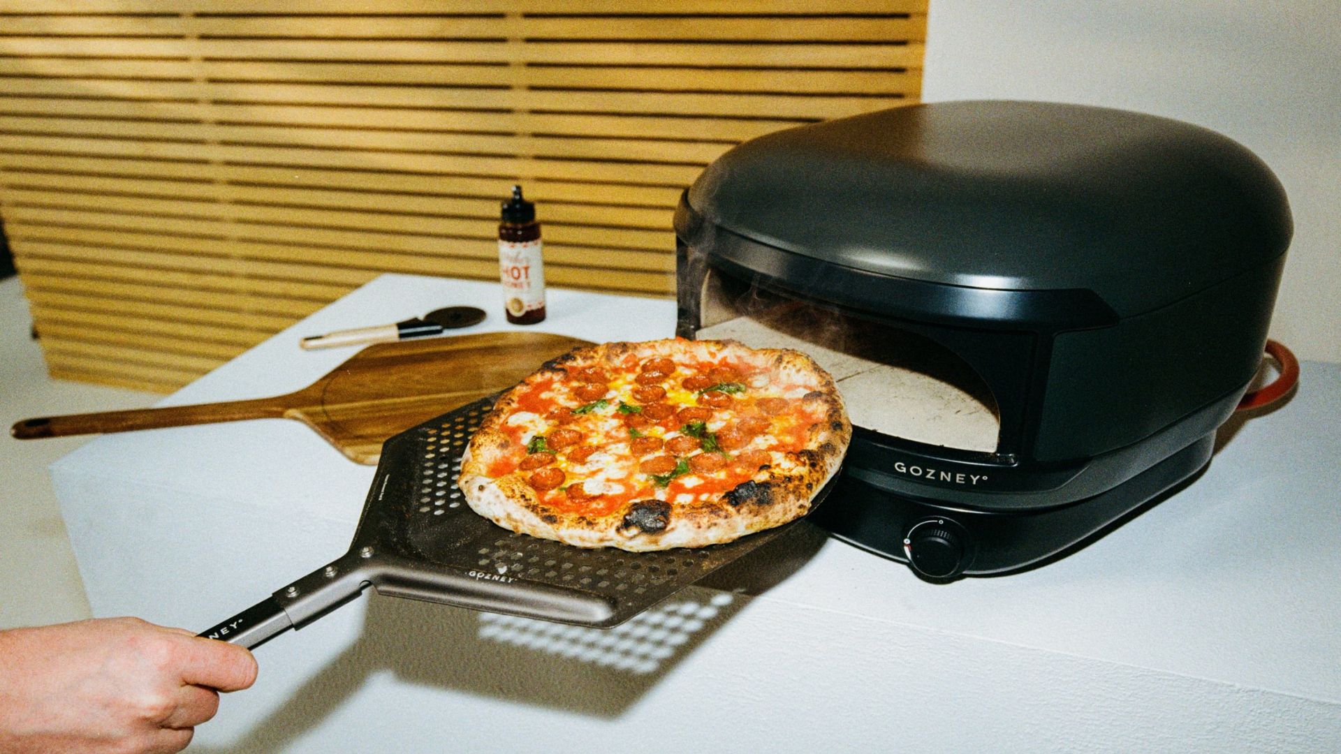 The Gozney Arc Lite Pizza Oven being used to cook pizza