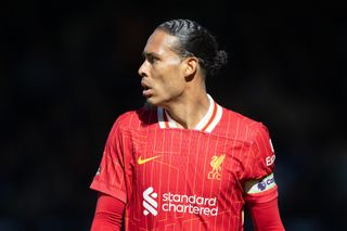 Liverpool captain Virgil van Dijk looks on during the Premier League match against Fulham at Craven Cottage in London, England on 6 April, 2025.