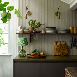 kitchen area with shelves and lamp