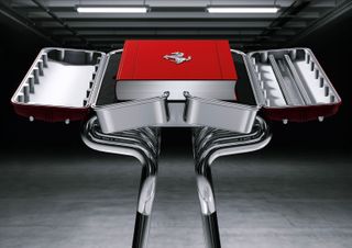 The Marc Newson designed stand holding the Ferrari 50th anniversary monograph