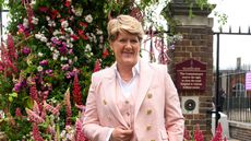 Clare Balding wearing a pink pinstripe suit