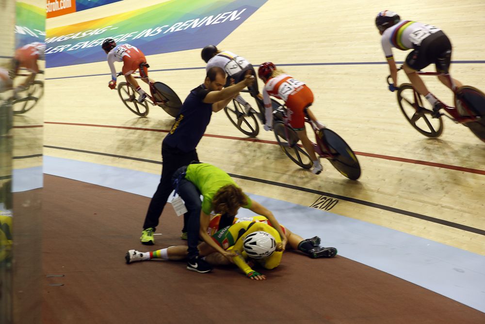 Staff tends to a crashed rider in the women's omnium