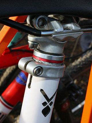 Conventional headset spacers help lock in the saddle height in addition to the conventional seatpost clamp.