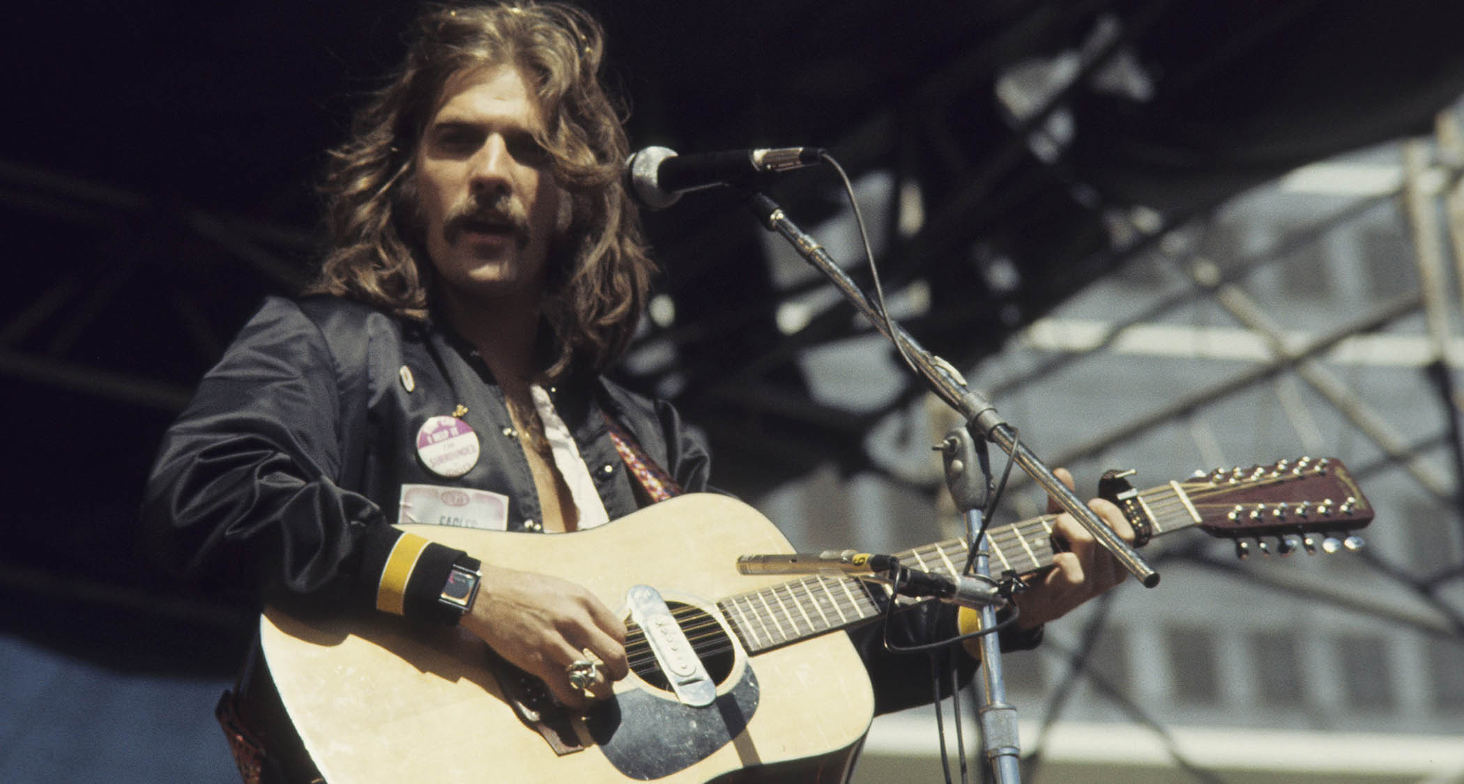Glenn Frey plays a Martin 12-string onstage with the Eagles in 1977.