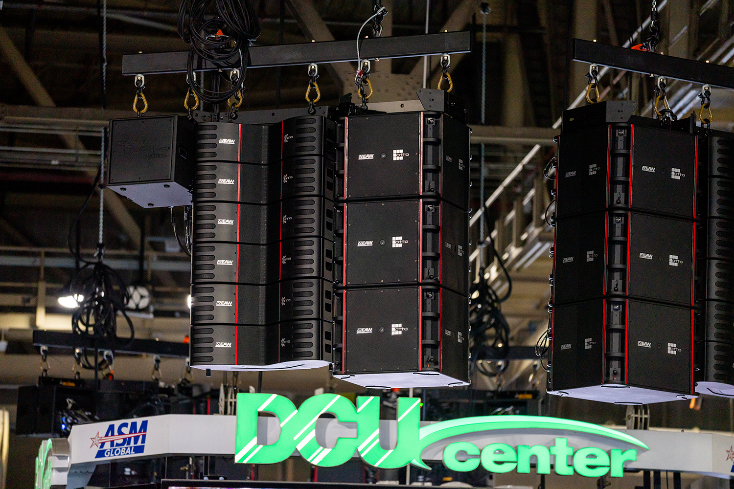 A new sound system and massive centerhang display hang from the rafters at the DCU Center.