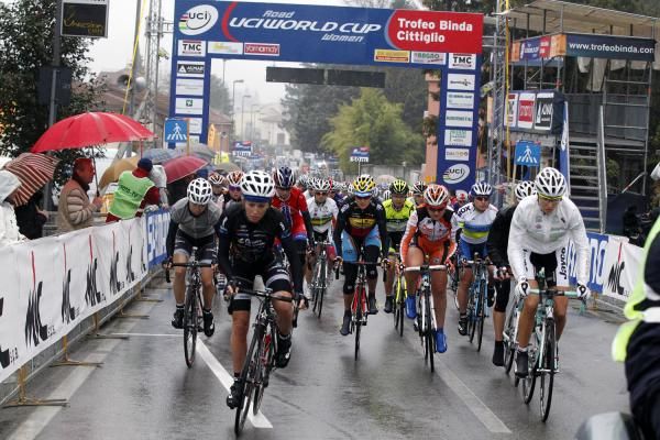 The peloton rides through the finish area