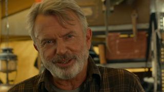 Dr. Alan Grant (Sam Neill) talks to Ellie Sattler in Jurassic World Dominion.