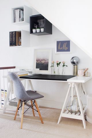 a white home office with a purple desk chair in the eves of a loft conversion
